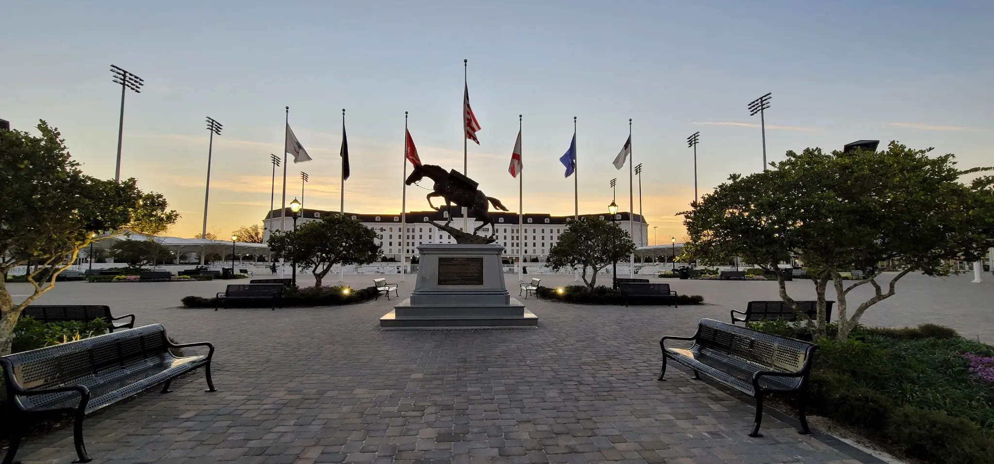 The Equestrian Hotel and the flag plaza at the World Equestrian Center in Ocala at sunset