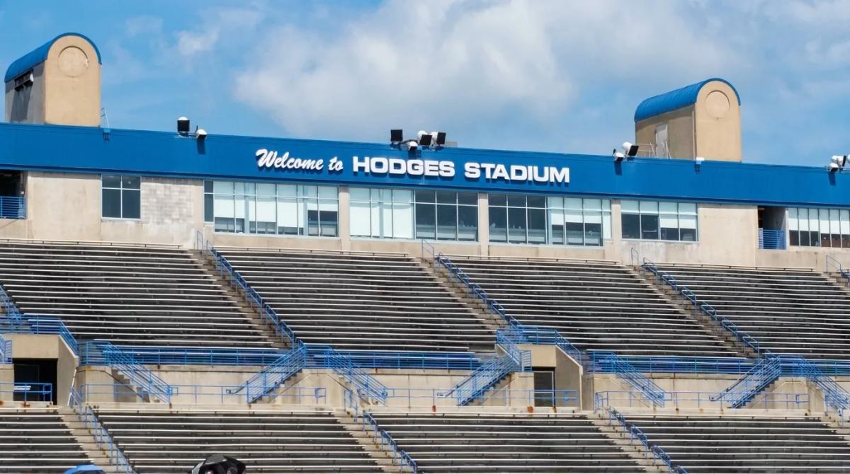 The main grandstand at Hodges Stadium on the UNF campus in Jacksonville, with the "Welcome to Hodges Stadium" sign above the seats